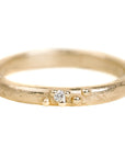 Textured Half Round Wedding Band In Yellow Gold With A Diamond