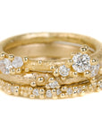 Textured Half Round Wedding Band In Yellow Gold With A Diamond